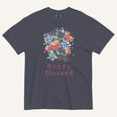 A dark gray crewneck t-shirt featuring a watercolor-style graphic of strawberries, blueberries, and blackberries with the text 'Berry Blessed' printed below in pink, displayed on a light cream background.
