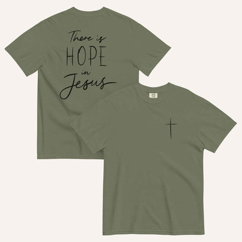 An army green t-shirt shown from both the front and back. The front features a small black cross on the top left. The back features the black text 'There is HOPE in Jesus' in a mix of script and block lettering.