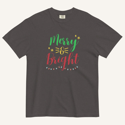 a dark grey t-shirt that has "Merry & Bright" colored text with Christmas lights and star graphics