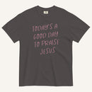 grey t-shirt with 'Today's a Good Day to Praise Jesus' pink text on a cream background