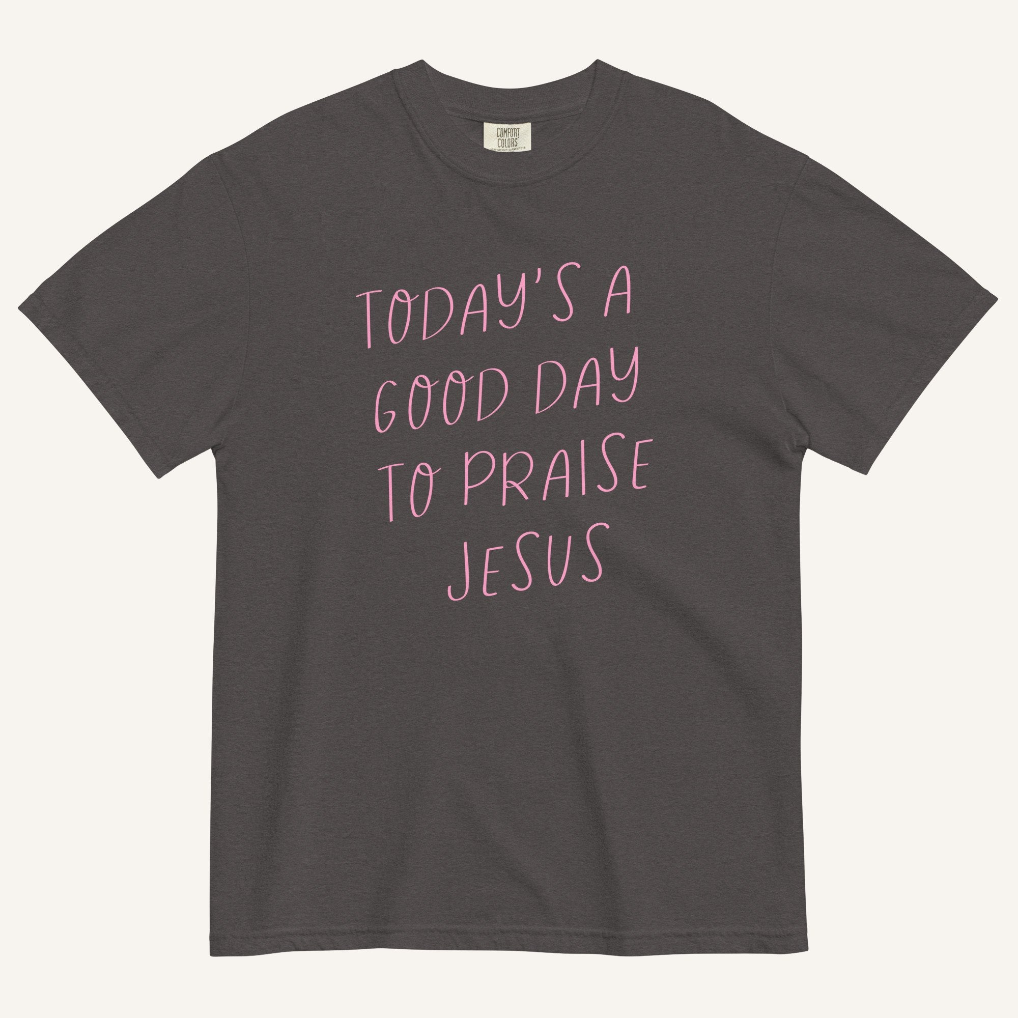 grey t-shirt with 'Today's a Good Day to Praise Jesus' pink text on a cream background