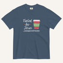 Blue Christmas T-shirt featuring the phrase “Fueled by Jesus …and peppermint mochas” with a festive peppermint mocha cup design.