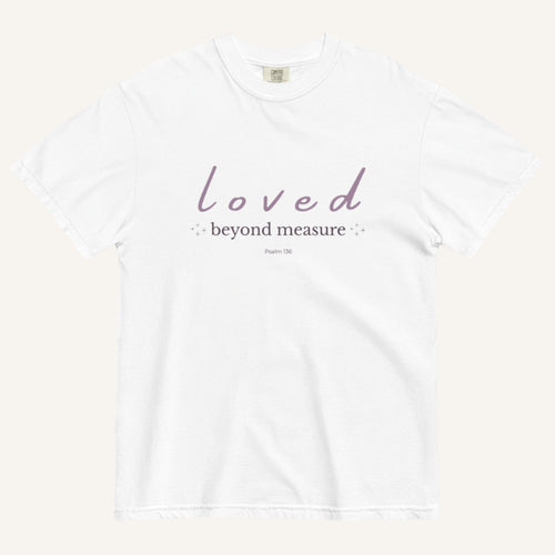 White t-shirt with 'loved beyond measure' text on a white background
