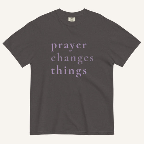 Gray t-shirt with 'prayer changes things' text on a white background