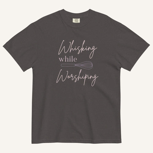 grey t-shirt with "Whisking while worshiping" text and a whisk graphic