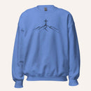 A blue crewneck sweatshirt featuring a black line art graphic of a cross on top of simple mountains on the chest, displayed against a solid off-white background.