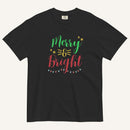 a black t-shirt that has "Merry & Bright" colored text with Christmas lights and star graphics