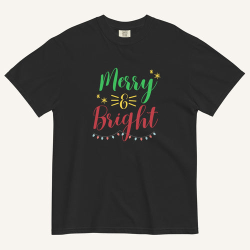a black t-shirt that has "Merry & Bright" colored text with Christmas lights and star graphics