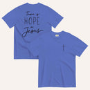 A royal blue purple t-shirt shown from both the front and back. The front features a small black cross on the top left. The back features the black text 'There is HOPE in Jesus' in a mix of script and block lettering.