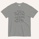 A grey short-sleeve t-shirt with a black graphic print on the front showing fish and loaves of bread, with the text 'He Provides' and 'Matthew 14:13-21'.