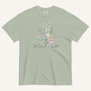 Green t-shirt with floral design and 'Matthew 6:28' text on a white background