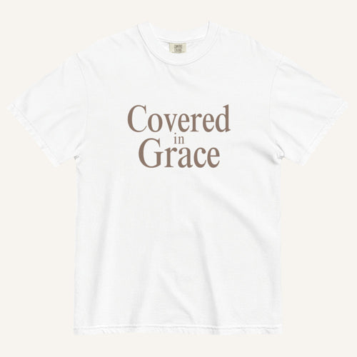 White t-shirt with 'Covered in Grace' text on a white background