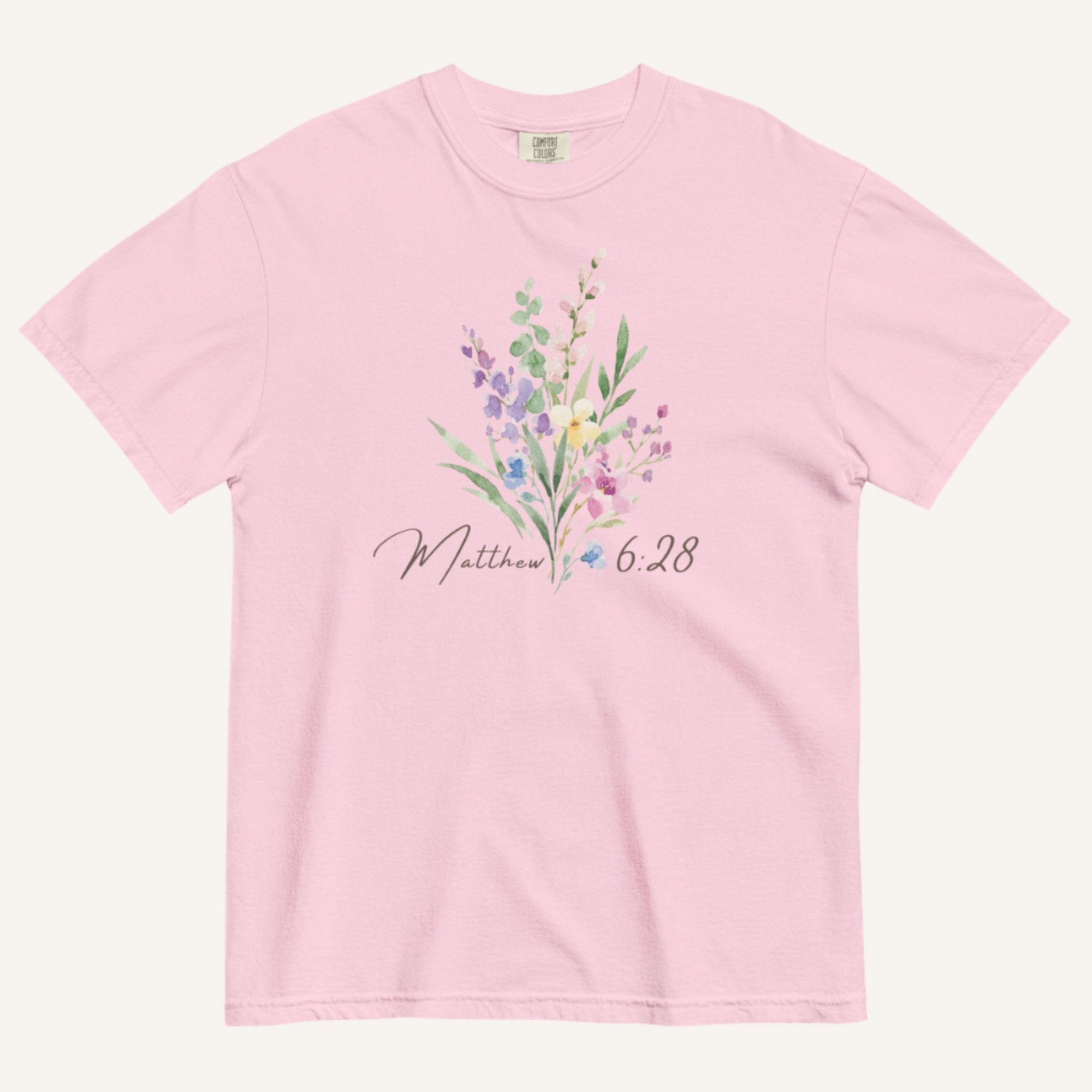 Light Pink t-shirt with floral design and 'Matthew 6:28' text on a white background