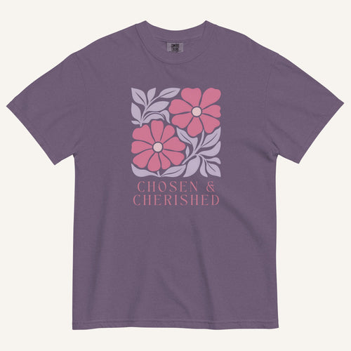 purple t-shirt with floral graphic and 'Chosen & Cherished' text on a cream background