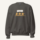 Grey unisex crewneck sweatshirt featuring a gold desert scene with three camels and a speech bubble reading “Are we there yet?”