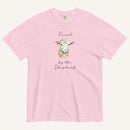 light pink t-shirt with watercolor lamb and 'Found by the Shepherd' text on cream background
