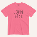 A hot pink short-sleeve crewneck t-shirt with 'JOHN 3 16' text with cross graphic in between the 3 & 16 printed in a black hand-drawn font on the chest, displayed flat against a light cream background.