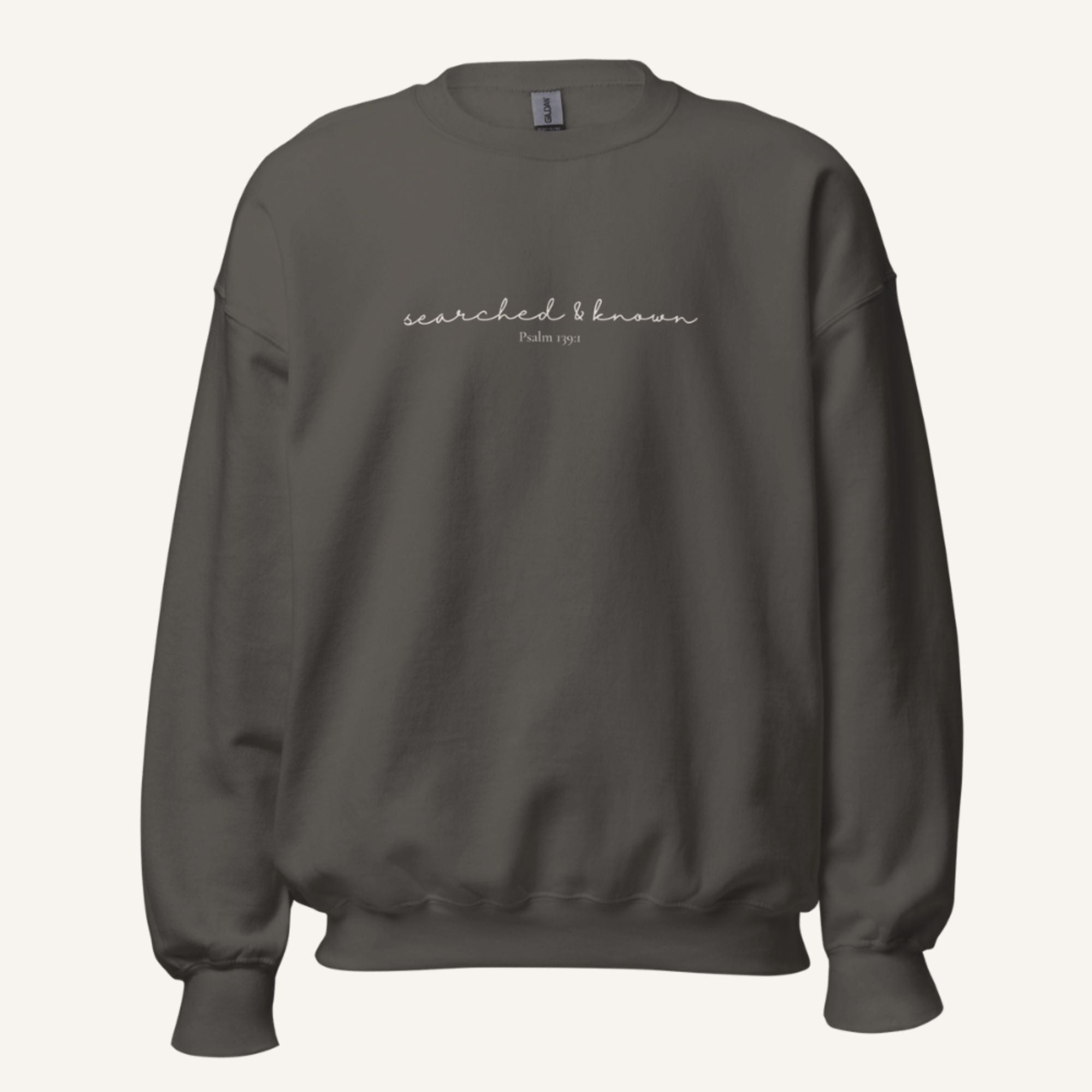 grey sweatshirt with 'Searched & known' text