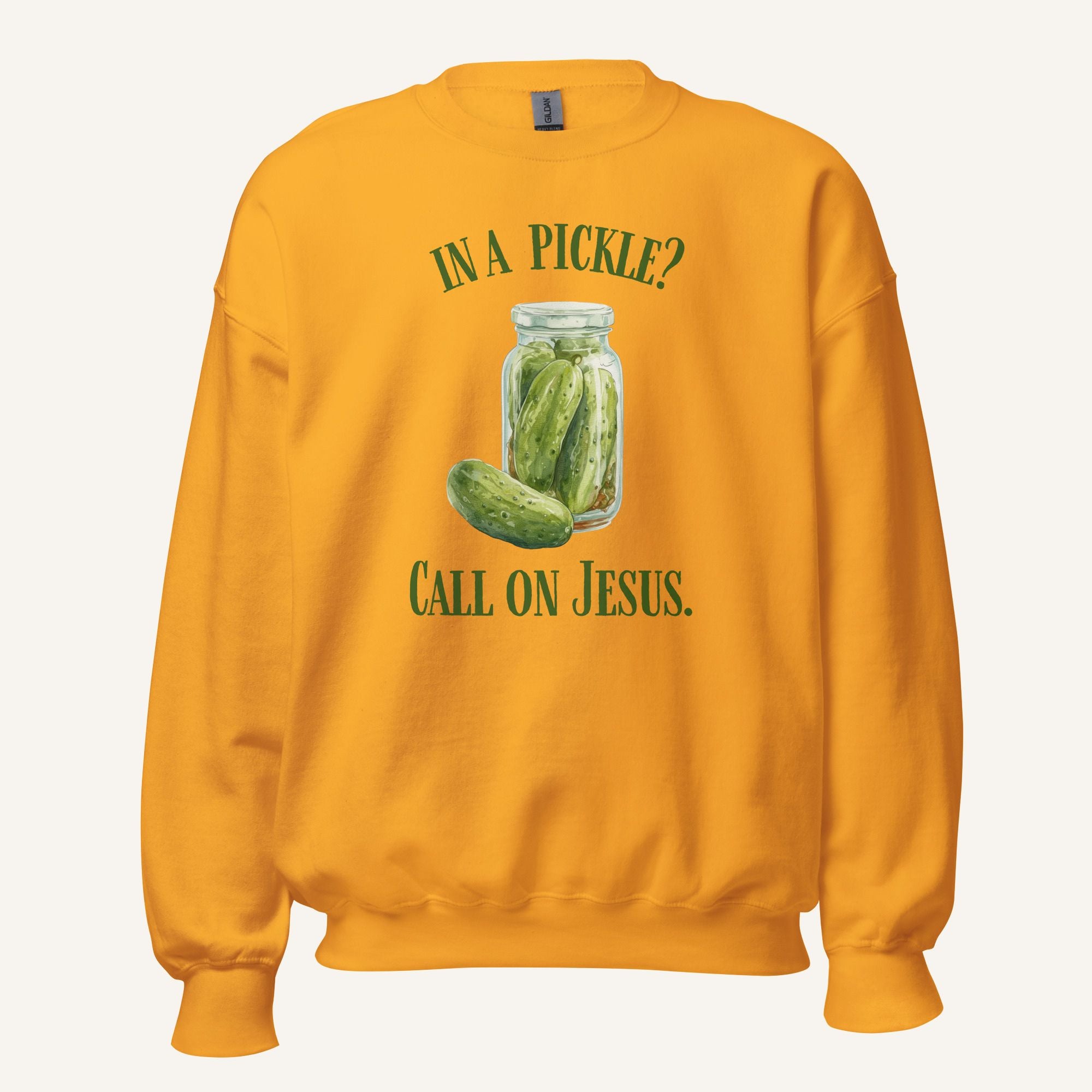 orange crewneck sweatshirt with a pickle jar graphic and 'In a Pickle? Call on Jesus' text on a cream background