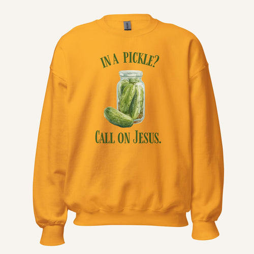 orange crewneck sweatshirt with a pickle jar graphic and 'In a Pickle? Call on Jesus' text on a cream background