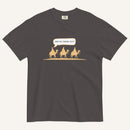 a dark grey t-shirt with 3 men riding camels in the color yellow with a chat bubble with the text "are we there yet?"