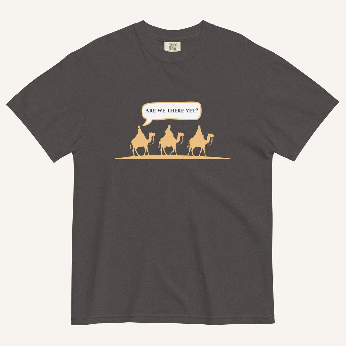 a dark grey t-shirt with 3 men riding camels in the color yellow with a chat bubble with the text "are we there yet?"