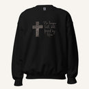 black sweatshirt with cross design and 'No longer lost, but found by Him' text on a cream background