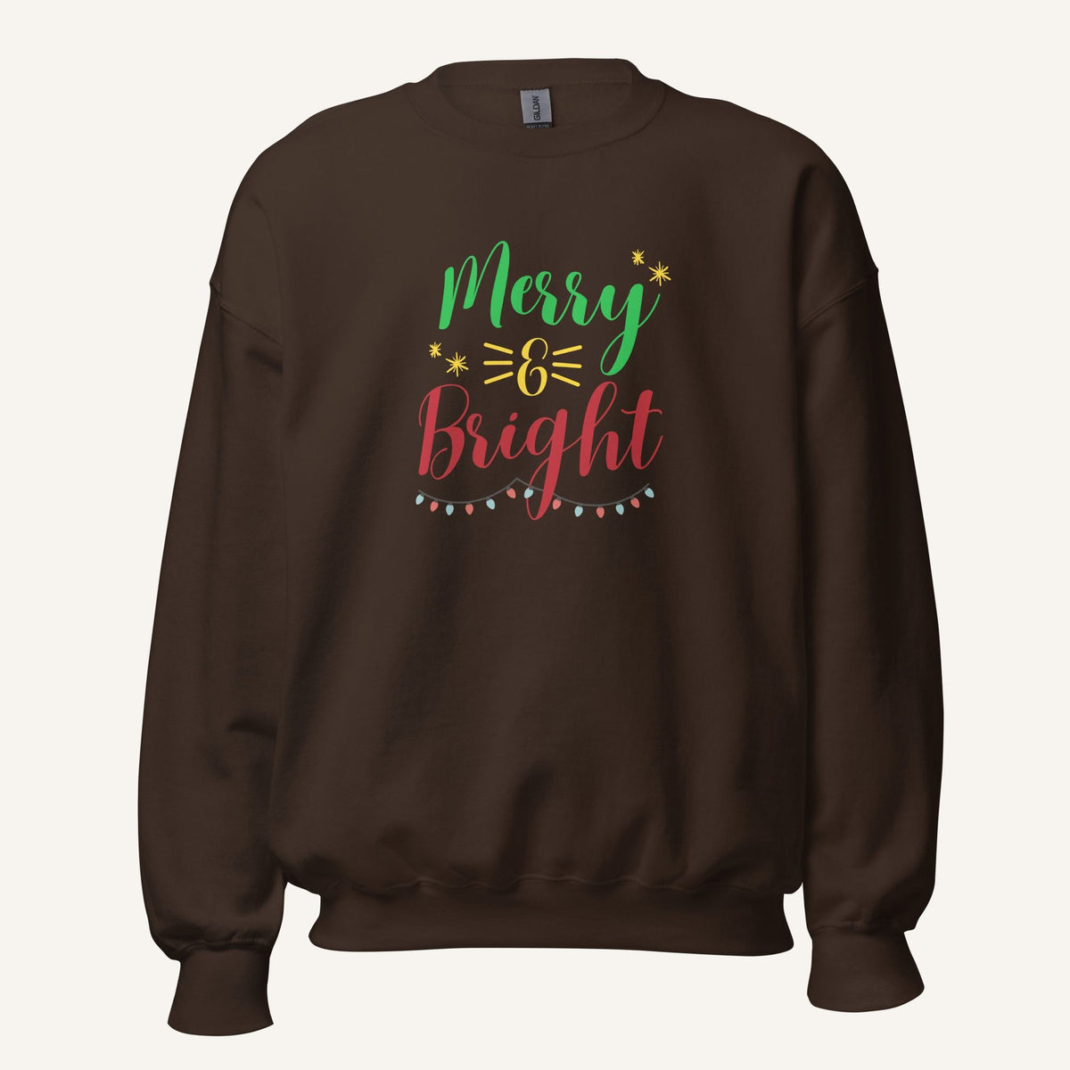 brown crewneck sweatshirt with "Merry & Bright" colorful text with Christmas lights and star graphics