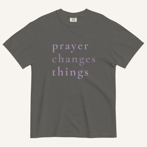 Gray t-shirt with 'prayer changes things' text on a white background