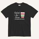 Black Christmas T-shirt featuring the phrase “Fueled by Jesus …and peppermint mochas” with a festive peppermint mocha cup design.