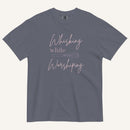 muted grey blue t-shirt with "Whisking while worshiping" text and a whisk graphic