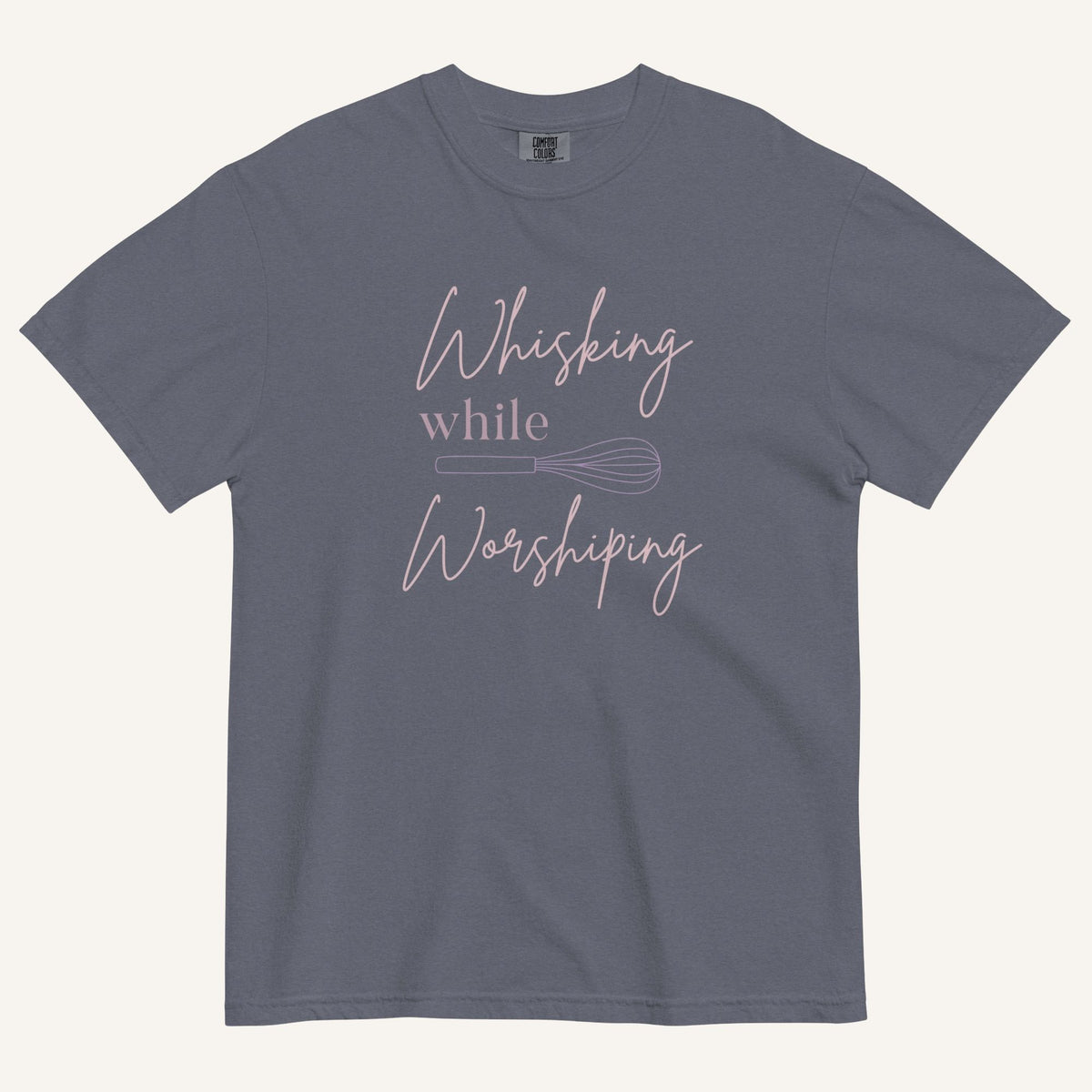 muted grey blue t-shirt with "Whisking while worshiping" text and a whisk graphic