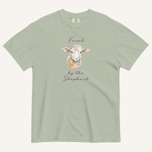 sage green t-shirt with watercolor lamb and 'Found by the Shepherd' text on cream background