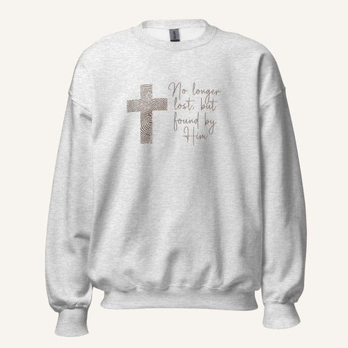 Ash grey sweatshirt with cross design and 'No longer lost, but found by Him' text on a cream background