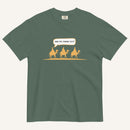a muted dark green t-shirt with 3 men riding camels in the color yellow with a chat bubble with the text "are we there yet?"