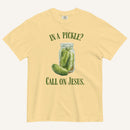 muted yellow colored t-shirt with pickle jar graphic and 'In a Pickle? Call on Jesus' text in green