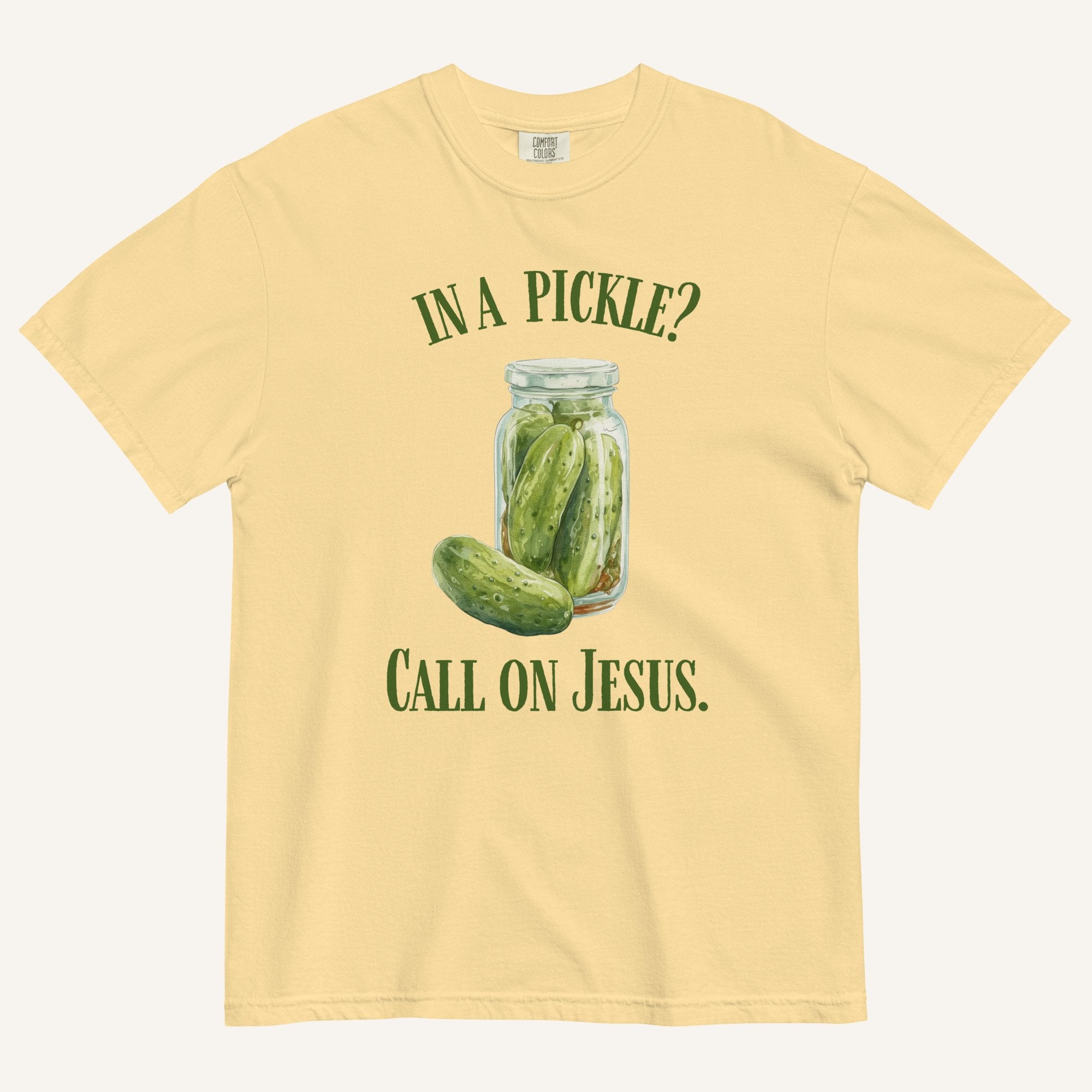 muted yellow colored t-shirt with pickle jar graphic and 'In a Pickle? Call on Jesus' text in green