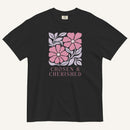 black t-shirt with floral graphic and 'Chosen & Cherished' text on a cream background