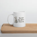 white 11 oz mug with a watercolor lamb and 'He left the 99 to find me' text sitting on a wooden board